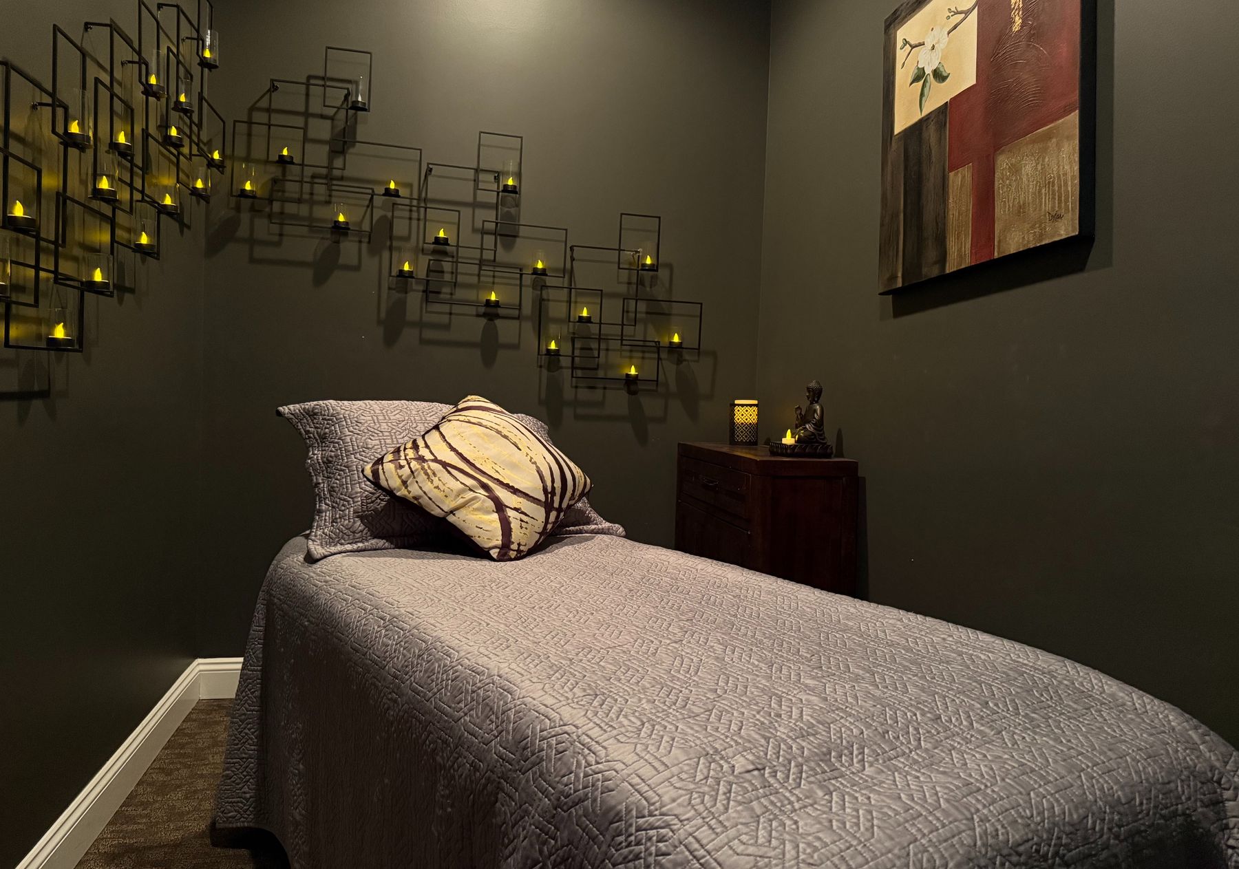 The massage room, lit by the candle wall